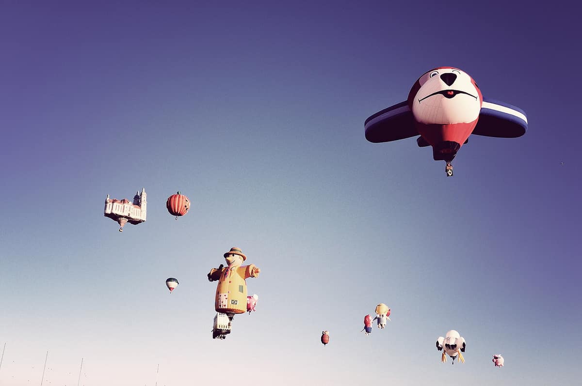 Special-shape balloons in the sky at the Balloon Fiesta