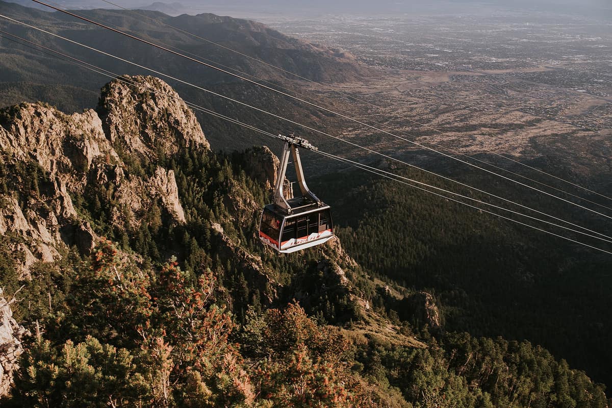 A tramway car nearing the top of the Sandia Mountains